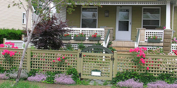 Good Neighbor Cedar lattice fencing by Elyria Fence