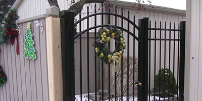 Ornamental Aluminum fence and arched gate by Elyria Fence Company