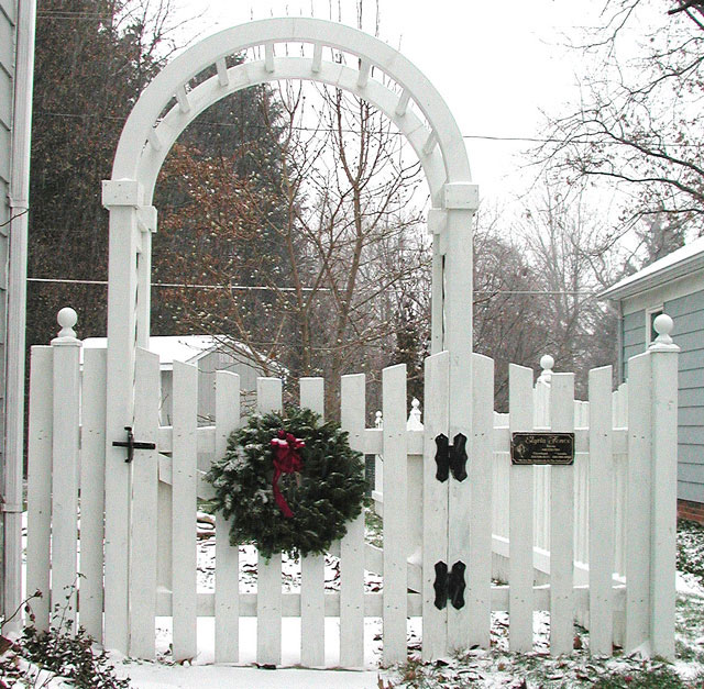 Spaced Sabre Scalloped Wood Picket Fence with Arbor & Gate by Elyria Fence