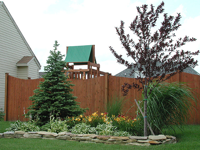 Sabre Scallop Wood Privacy Fence by Elyria Fence