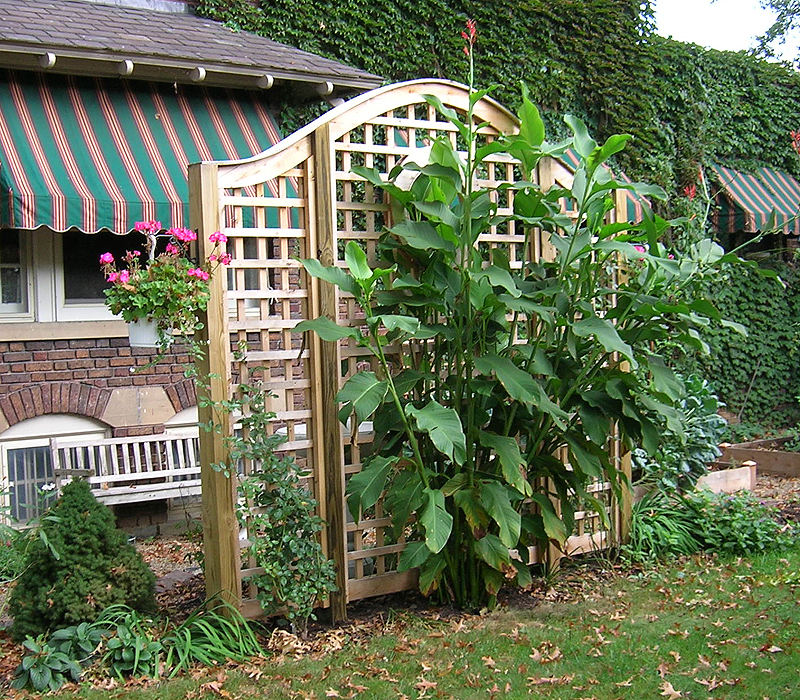 Arched square lattice wood vine trellis by Elyria Fence