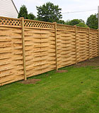 wood arbor with a gate and semi private fence