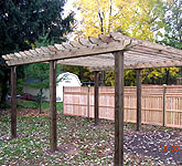 wood pergola with semi private wood fence by elyria fence