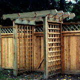wood pergola with square lattice vine trellis by elyria fence
