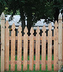 spaced scalloped wooden white cedar imperial picket fence with finials posts by Elyria Fence