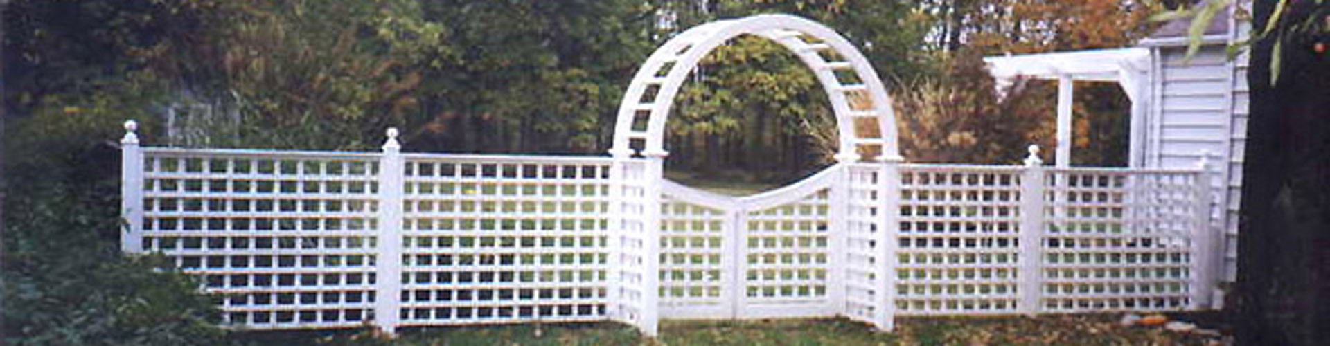 Square Lattice Fencing with an arbor by Elyria Fence