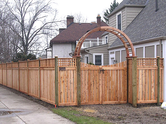 Wood Arbor with double gate and semi-private fence by Elyria Fence