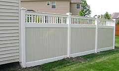 Vinyl two color privacy fence by Elyria Fence